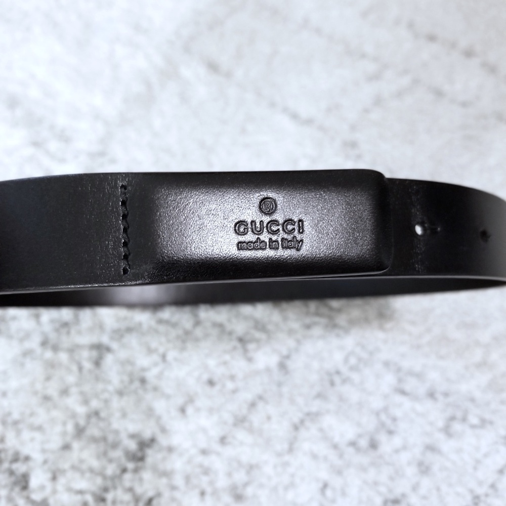 Gucci Embossed Black Leather Belt.   Authentic